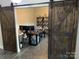 Spacious home office features built-in shelving and barn door at 4308 29Th Street Ne Dr, Hickory, NC 28601