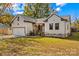 Beige house with stone accents, garage, and landscaped yard at 523 Carolina Blvd, Salisbury, NC 28146