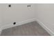 Laundry room with gray tile floor and white walls at 7324 Pleasant Grove Rd, Charlotte, NC 28216