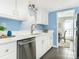 Modern kitchen with white cabinets and stainless steel appliances at 8002 Regent Park Ln, Charlotte, NC 28210