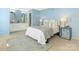 Serene bedroom offers light blue walls, a comfortable bed, and en-suite bathroom access at 8002 Regent Park Ln, Charlotte, NC 28210