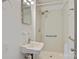 Small bathroom includes a shower, sink, and grab bars at 841 12Th Nw Ave, Hickory, NC 28601