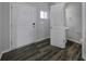 Modern foyer with dark hardwood floors and powder room at 1243 Scotch Meadows Loop, Monroe, NC 28110