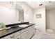 Modern basement bathroom with dark countertop and updated fixtures at 1701 Cavendish Ct, Charlotte, NC 28211