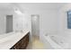 Bathroom boasts double vanity, soaking tub, and separate shower at 1982 Wexford Ct, Gastonia, NC 28054