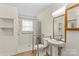 Accessible bathroom with shower, toilet, and sink at 4501 Taylorsville Hwy, Statesville, NC 28625