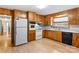 Bright kitchen featuring wood cabinets and appliances at 4501 Taylorsville Hwy, Statesville, NC 28625