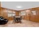 Dining area with wood paneling and a round table with four chairs at 4501 Taylorsville Hwy, Statesville, NC 28625