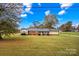 Ranch-style home situated on a spacious lot with mature trees at 4501 Taylorsville Hwy, Statesville, NC 28625