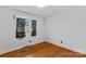Simple bedroom with hardwood floors and window at 4501 Taylorsville Hwy, Statesville, NC 28625