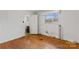 Bedroom with hardwood floors and access to bathroom at 4501 Taylorsville Hwy, Statesville, NC 28625