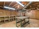 Unfinished basement with workbench and shelving at 4501 Taylorsville Hwy, Statesville, NC 28625