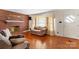Living area with hardwood floors, brick fireplace and neutral decor at 4501 Taylorsville Hwy, Statesville, NC 28625