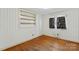Bedroom with built-in shelving and wood flooring at 4501 Taylorsville Hwy, Statesville, NC 28625