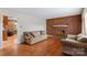 Living room features a brick fireplace and hardwood floors at 4501 Taylorsville Hwy, Statesville, NC 28625