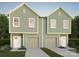 New construction duplex with two-car garages and light green exterior at 630 Austin Dr, Charlotte, NC 28213