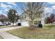 Two-story house with attached garage and landscaping at 9702 Eagle Feathers Dr, Charlotte, NC 28214