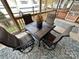 Relaxing screened porch with patio furniture and rug at 141 Cardinal Ave, New London, NC 28127