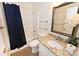 Bathroom with granite vanity and navy shower curtain at 2123 13Th Street Ne Ct, Hickory, NC 28601