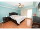 Bright main bedroom with hardwood floors and ceiling fan at 2123 13Th Street Ne Ct, Hickory, NC 28601