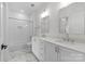 Modern bathroom with double vanity, marble floors, and shower/tub combo at 3000 South Blvd # 305, Charlotte, NC 28209