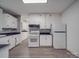 Renovated kitchen, white appliances, and dark countertops at 41 Calhoun St, Great Falls, SC 29055