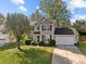 Two-story house with gray siding, attached garage, and landscaping at 4721 Buckminister Ct, Charlotte, NC 28269