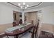 Formal dining room with oval table and chandelier at 4721 Buckminister Ct, Charlotte, NC 28269