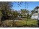Fenced backyard with shed and partial view of woods at 7318 Old Mt Holly Rd, Charlotte, NC 28214