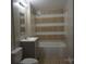 Updated bathroom with gray vanity, bathtub, and tiled walls at 7318 Old Mt Holly Rd, Charlotte, NC 28214