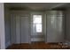 Spacious bedroom with hardwood floors and double closets at 7318 Old Mt Holly Rd, Charlotte, NC 28214