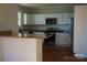 Modern kitchen with granite countertops and white cabinets at 7318 Old Mt Holly Rd, Charlotte, NC 28214