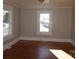 Bright living room featuring hardwood floors and large windows at 7318 Old Mt Holly Rd, Charlotte, NC 28214