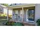 Charming front porch featuring rocking chairs and a welcoming entrance at 1155 Counselor Dr, Newton, NC 28658