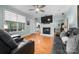 Spacious living room featuring a fireplace, hardwood floors, and comfortable seating at 1246 Hillsboro Ave, Hickory, NC 28602