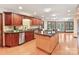 Spacious kitchen with island, granite counters, and lake views at 376 Oak Tree Rd, Mooresville, NC 28117