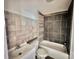 Updated bathroom with a white vanity and dark gray tile at 722 Tanglewood Dr, Salisbury, NC 28144