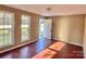 Simple bedroom with hardwood floors and two large windows at 722 Tanglewood Dr, Salisbury, NC 28144