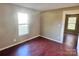 Simple bedroom with hardwood floors and a large window at 722 Tanglewood Dr, Salisbury, NC 28144