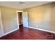 Spacious bedroom with wood floors and access to hallway at 722 Tanglewood Dr, Salisbury, NC 28144