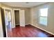 Bright bedroom with wood floors, spacious closet, and access to another room at 722 Tanglewood Dr, Salisbury, NC 28144