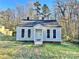 Newly renovated gray house with a white door, steps, and a grassy yard at 722 Tanglewood Dr, Salisbury, NC 28144