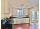 Simple kitchen with white cabinets, granite countertops, and dark wood floors at 722 Tanglewood Dr, Salisbury, NC 28144