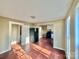 Open concept kitchen and living area with wood floors and black refrigerator at 722 Tanglewood Dr, Salisbury, NC 28144