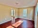 Bright living room with hardwood floors and large windows at 722 Tanglewood Dr, Salisbury, NC 28144