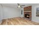 Living room with fireplace and light wood floors at 1744 Laurel Ln, Gastonia, NC 28054