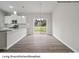 Modern kitchen features breakfast bar and sliding glass doors to backyard at 204 Lake George Dr, Shelby, NC 28152
