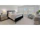Bright bedroom with a comfortable bed, nightstands, and ample natural light at 208 Waterlynn Ridge Rd # B, Mooresville, NC 28117