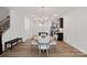 Open dining area with round table, chandelier, and view of the kitchen at 208 Waterlynn Ridge Rd # B, Mooresville, NC 28117