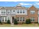 Brick and gray siding townhome with landscaping and a front door at 208 Waterlynn Ridge Rd # B, Mooresville, NC 28117